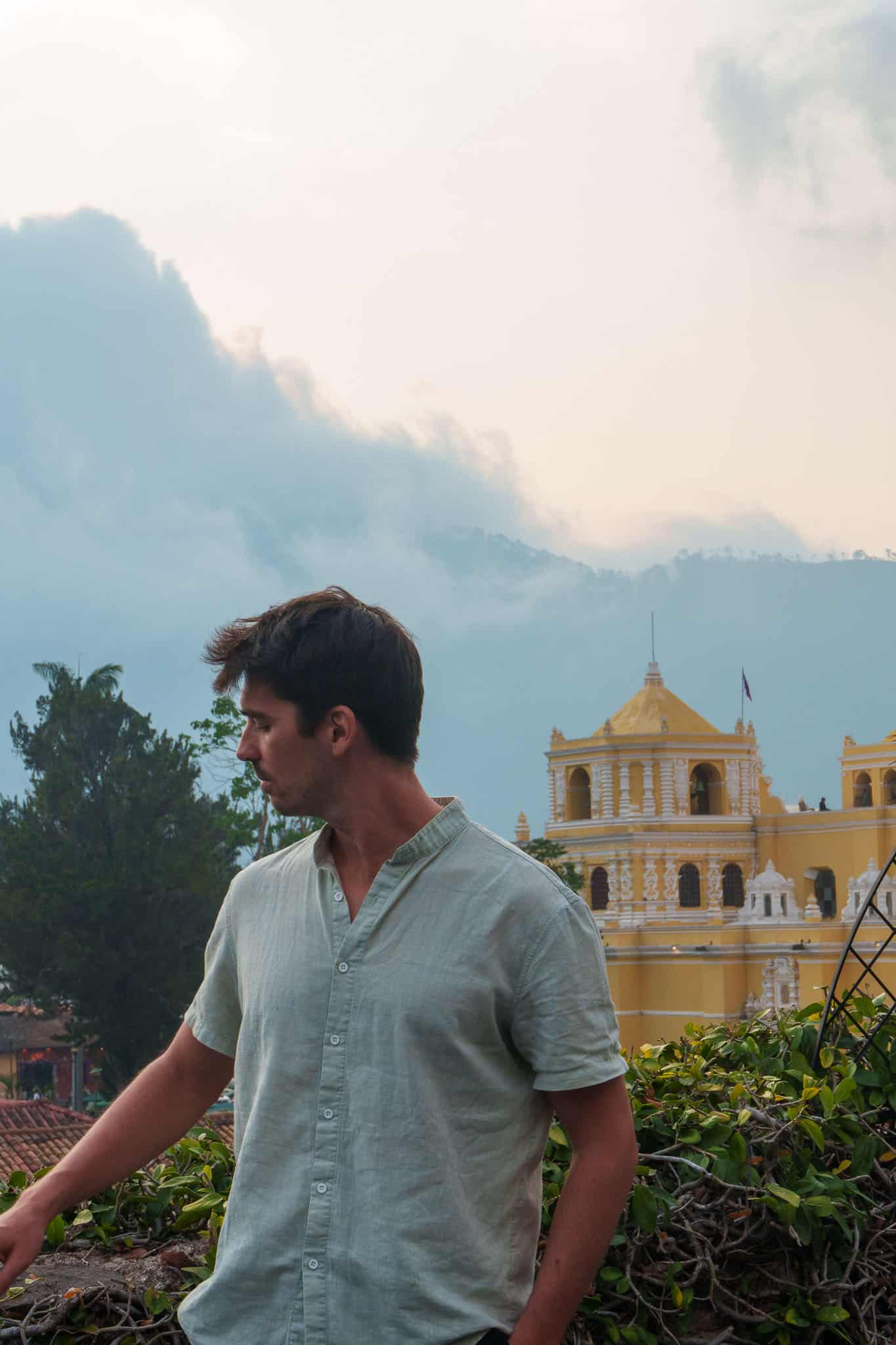 Me posing for the photo on a rooftop in Antigua. We can see the church la merced in the background.