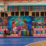 Walls inside a gymnasium in San Pedro city in Guatemala ( Lake Atitlan). The walls are full of art representing the local culture with children, colors, clothes and animals of Guatemala.