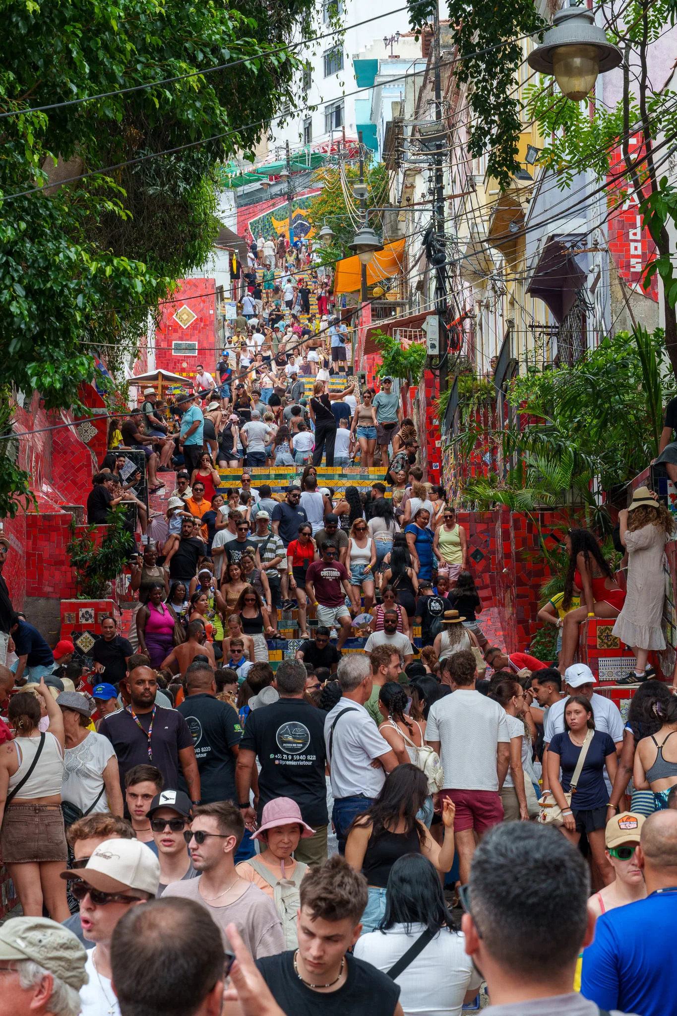 Selaronstairs at miday cudring the carnaval period in rio de janeiro. the stairs are full of tourist taking pictures.