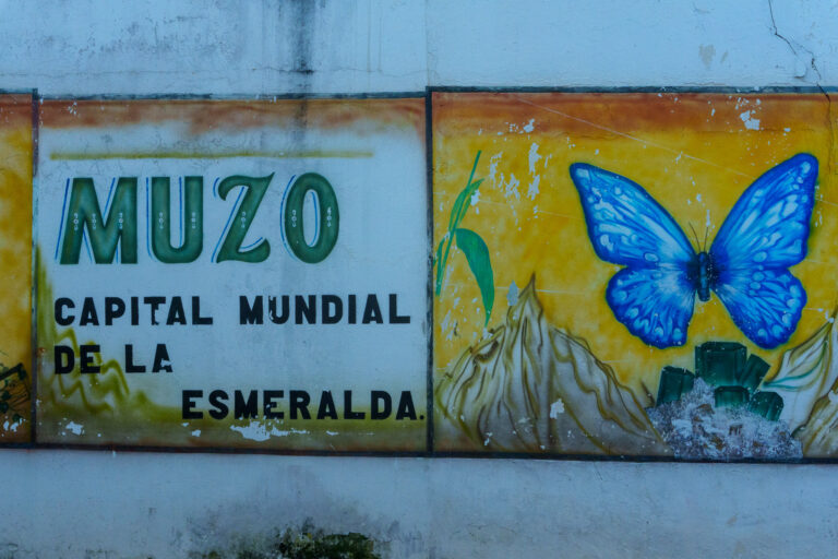 Wall Art at Muzo City saying " Muzo, the world capital of emeralds"