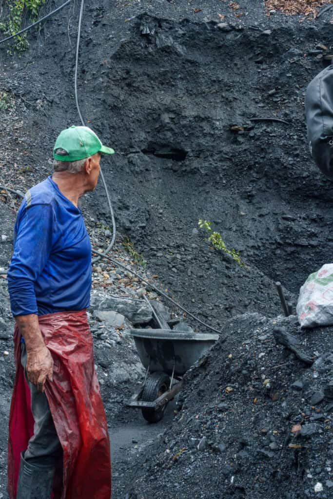 Miners working trying to excave rocks to find emerald in muzo region