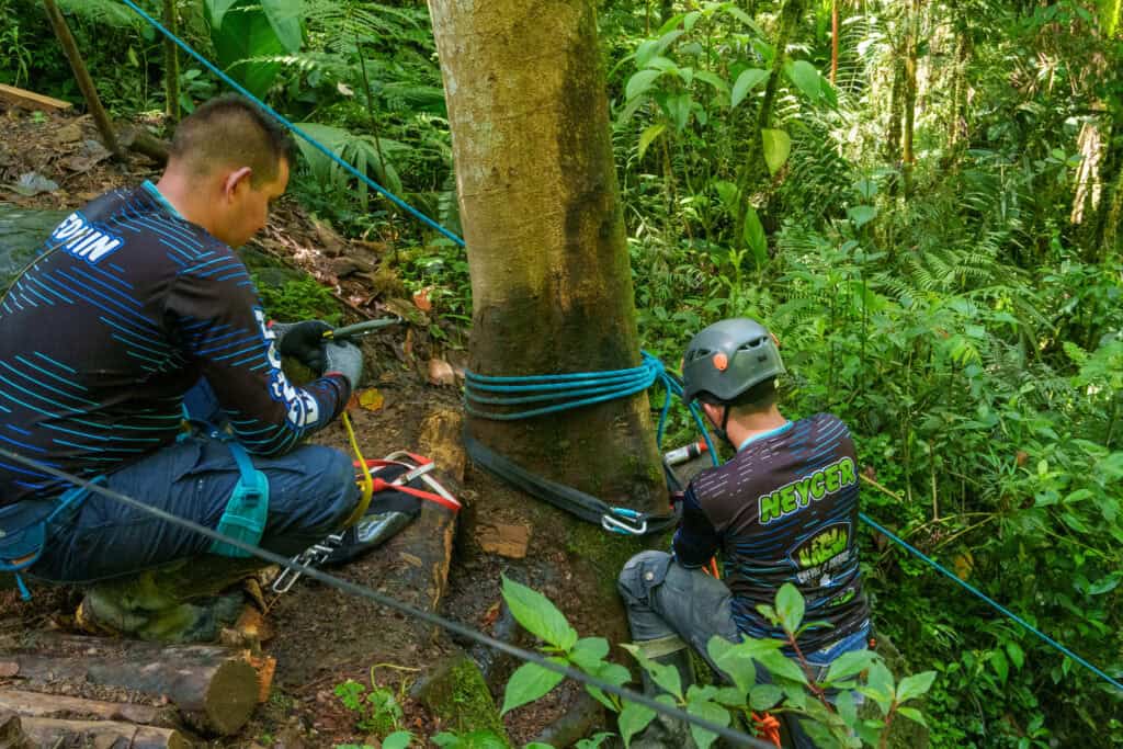 The guide team preparing the rope to secure us to go down the cae by doing rappel