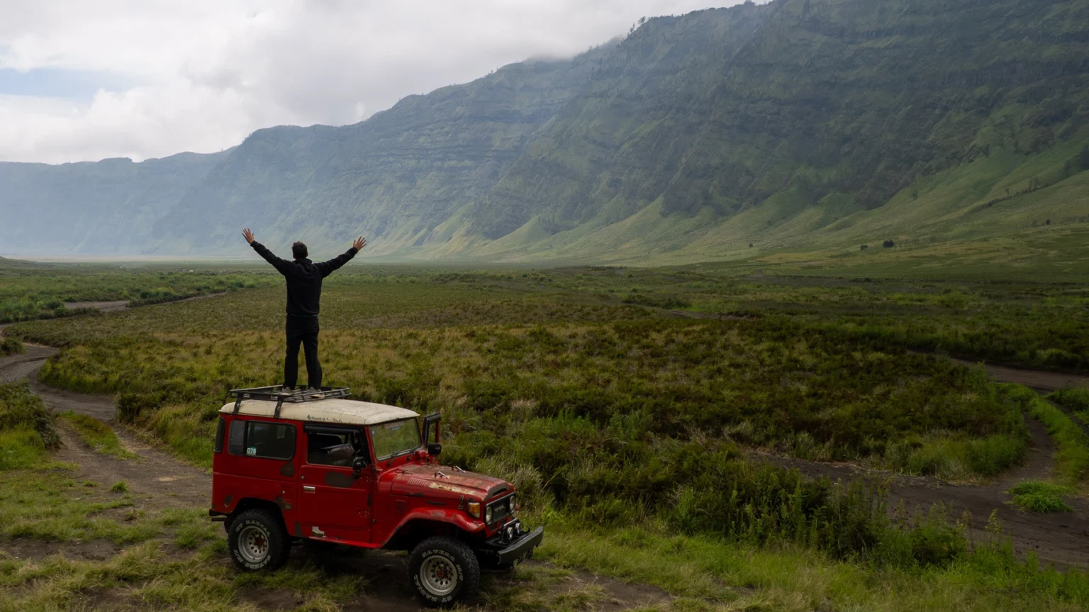 Me Standing on a 4x4 in the Valley Next to Bromo Volcano in Indonesia