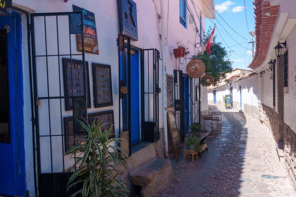 Tandapata street in Cusco touristic district, filled with many shops and coffee places