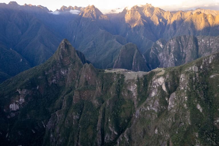 Aerial view of the Machu Picchu archeological site with its surroundings mountains, like the huayna picchu, the machu picchu and many more