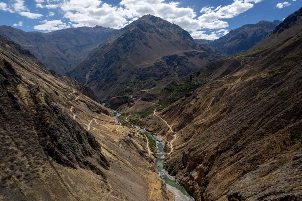 Aerial view of the river down the colca canyon near Llahuar village where there are two bidges to cross one side to the other