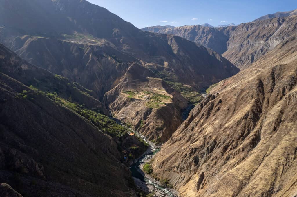 Aerial view of the colca canyon with the Llahuar villages and the hotels down the canyon