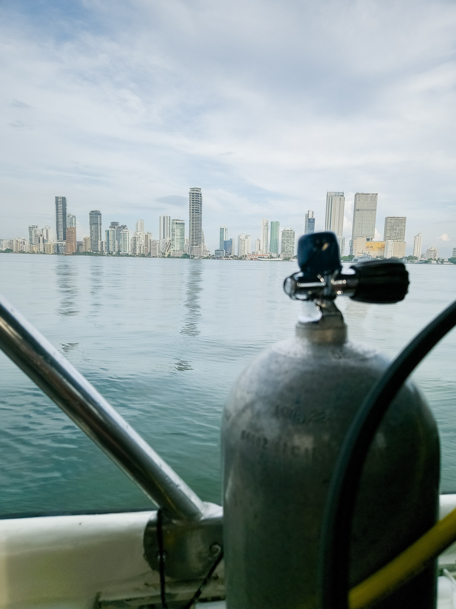 air tank to dive with Cartagen Divers in the foreground with Cartagena modern district with skycrapers in the background.