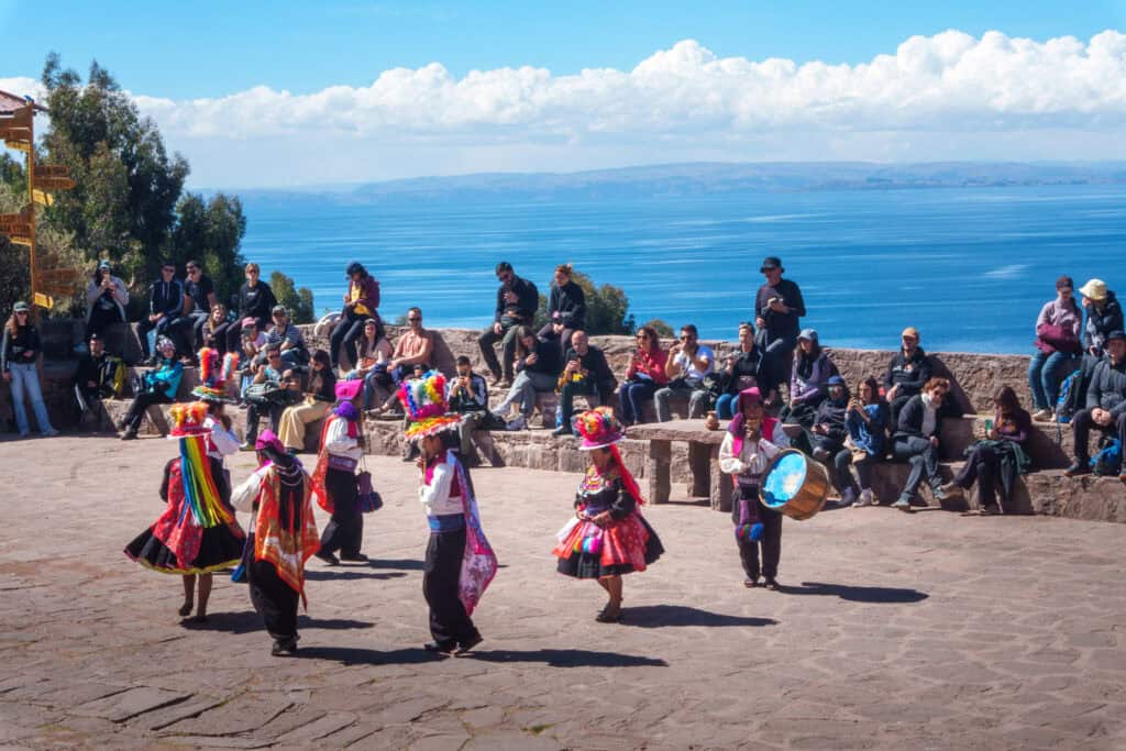 Taquile community performing music and dancing for tourist curious about their culture