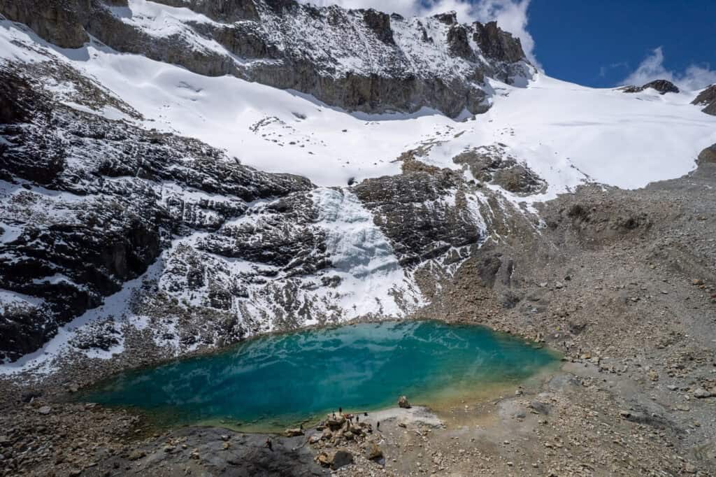 Aerial view of Charquini glaciar and the emerald lagoon