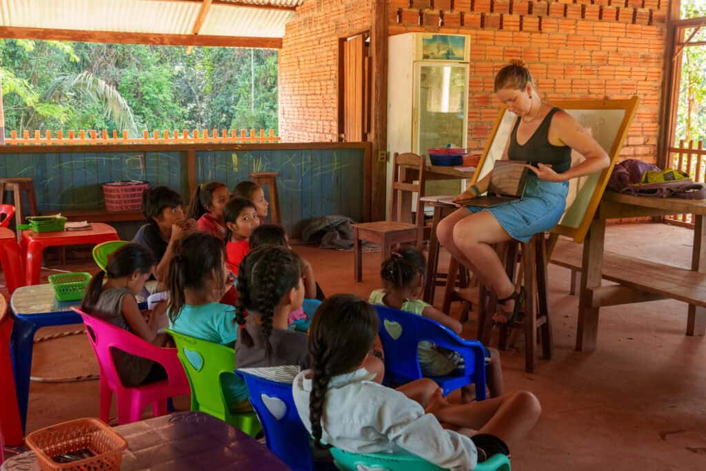 Leah, a volunteer at sustainable bolivia, giving an english class the bolivian children at Warnes village, Bolivia