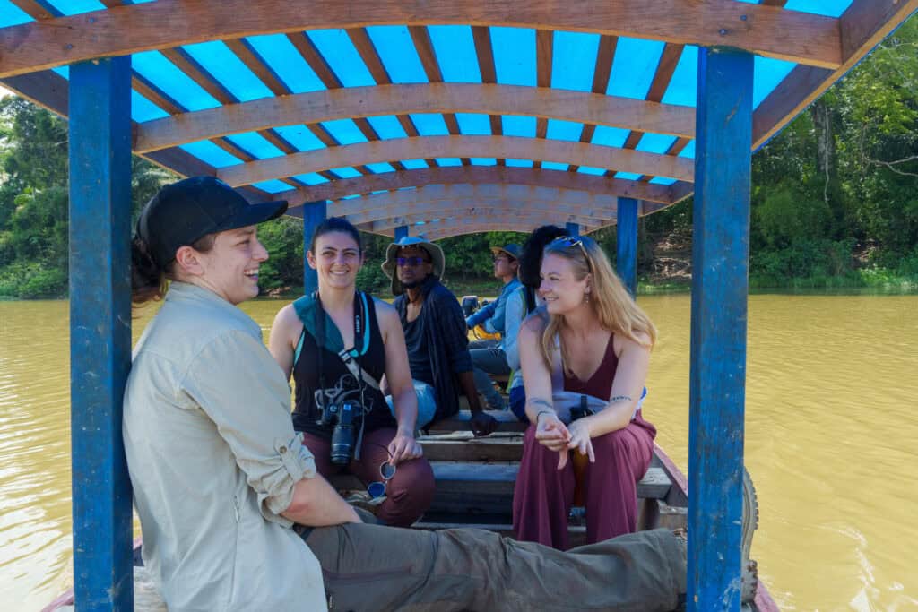 Volunteers on sustainable boliva's boat doing research in the aquicuana reserve, Bolivia