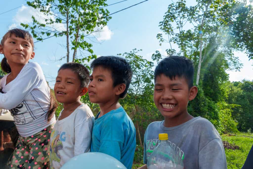 Three boys and one girls from the warnes villages near Riberalta, Bolivia, smiling after a class lessons from sustainable bolivia.