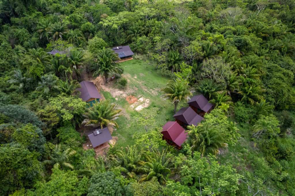 aerial view of the sustainaible bolivia buildings in the amazon rainforest, Bolivia. There ar ehouses and trees
