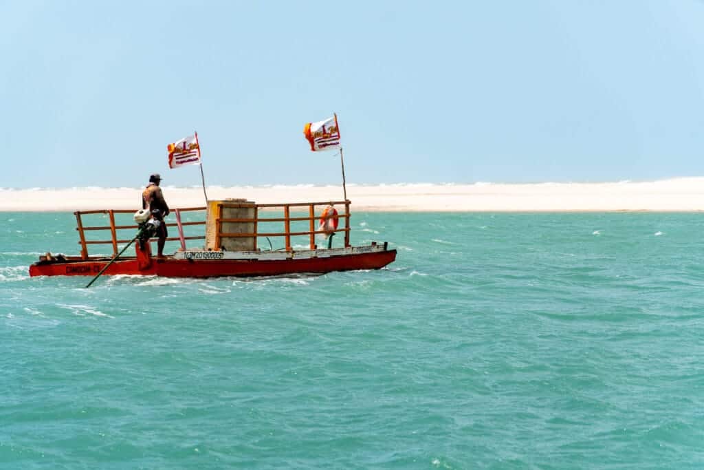 Empty boat than transport quad, buggy and motos from one side to the other during the quad tour on the west side of Jericoacoara.
