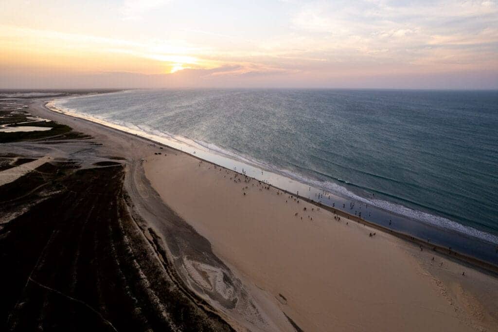 Aerial view of the dunes of Jericoacoara where people come every evening to watch the sunset from there.