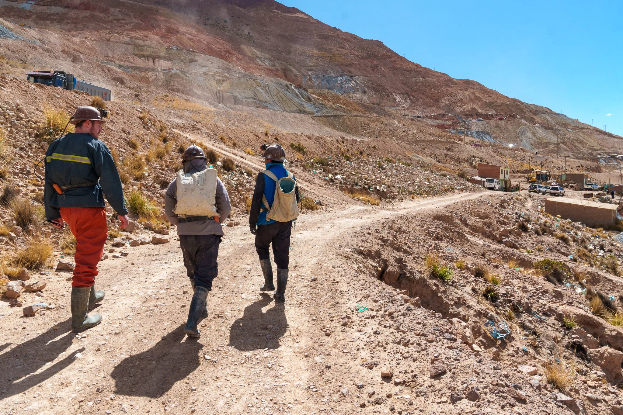 Group of tourist going to the mines of Potosi do to a tours with their guide.