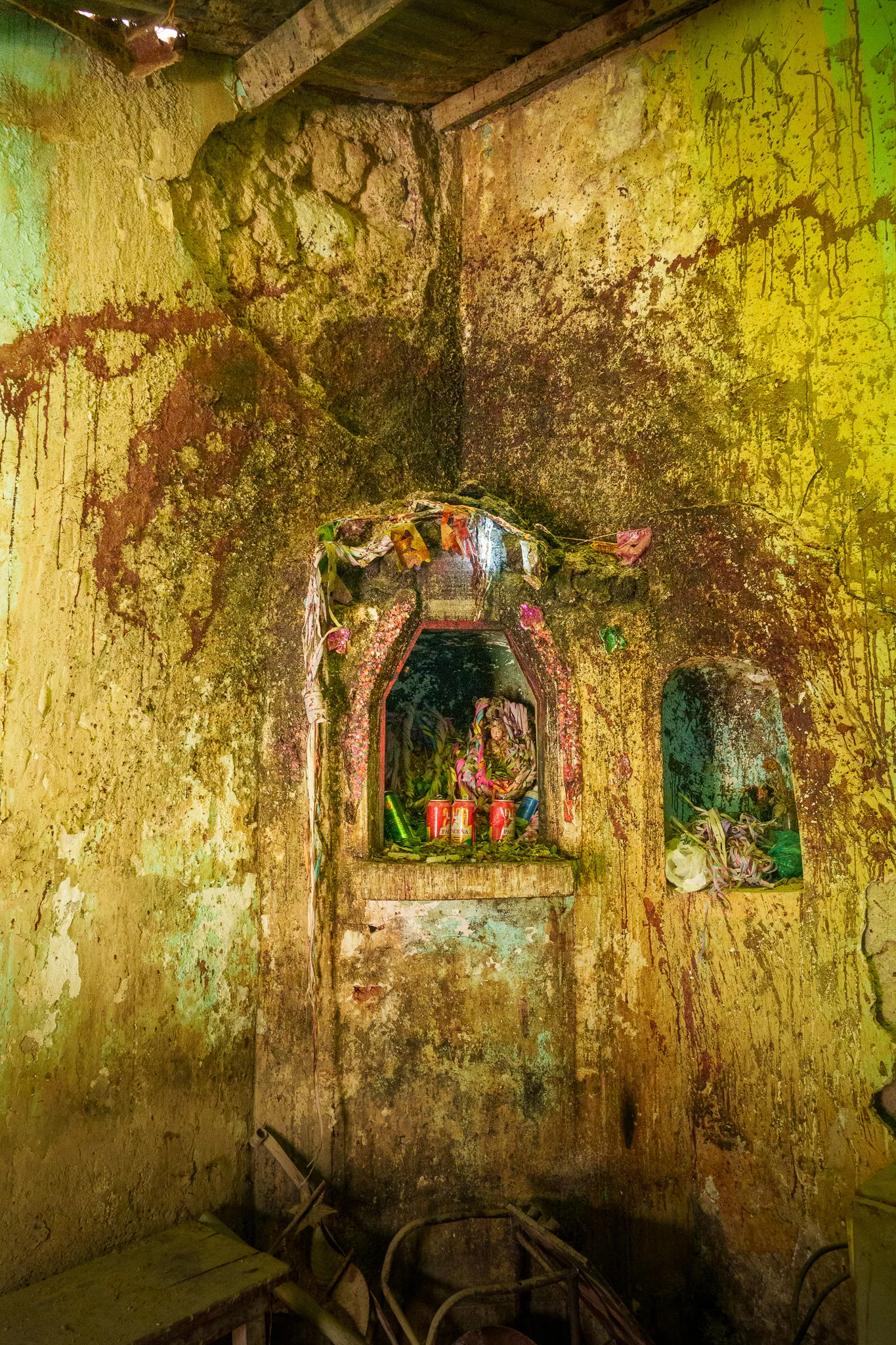 Statue of el Tio at the entrance of the mine. offrand are made, with alcool, coca leaves and also llama blood that is spilled on the walls.
