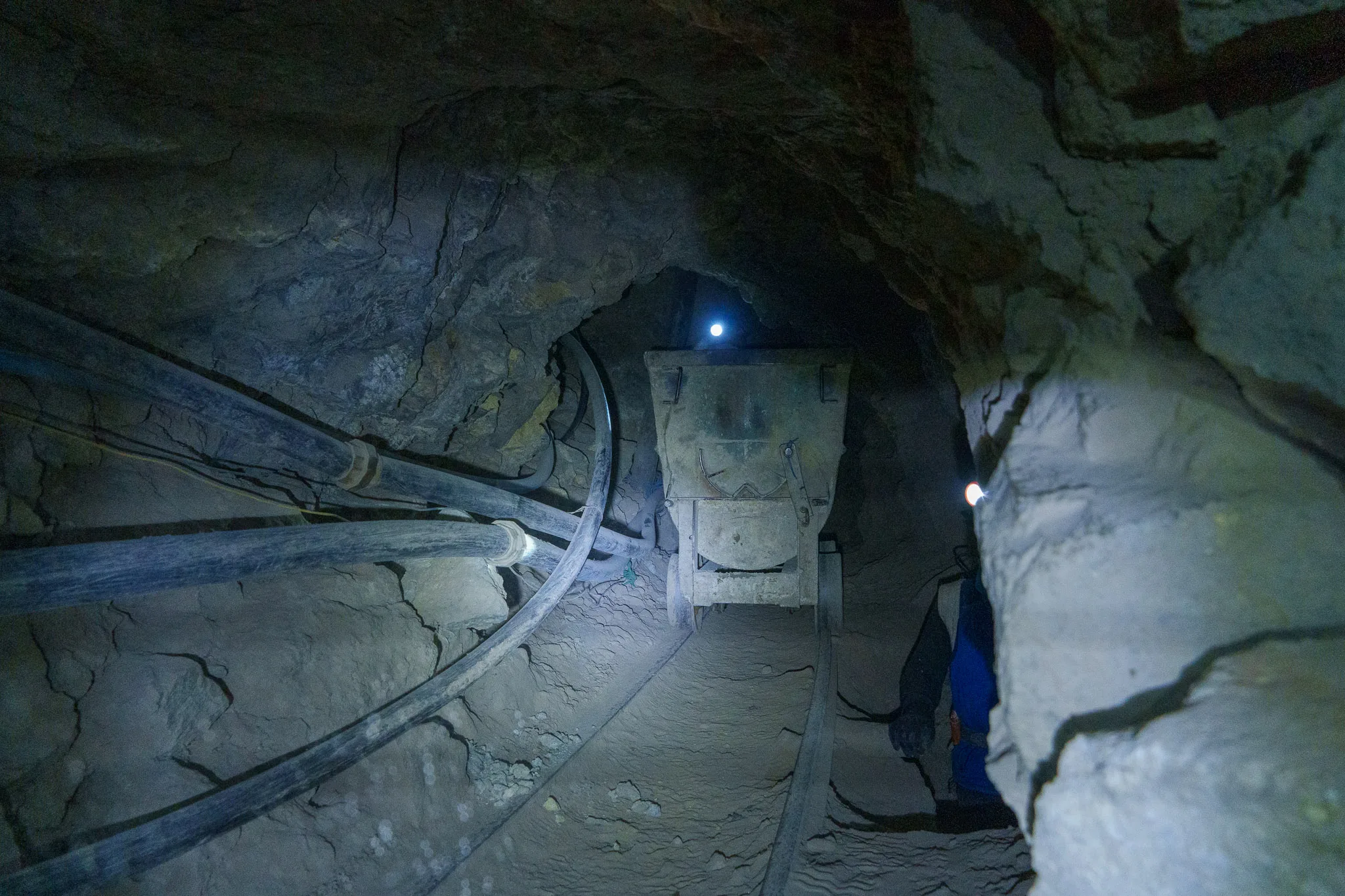 Mine cart full of ore exiting the mine in Cerro Rico, in Potosi, Bolivia. We need to put ourselve on the side to let the mine cart pass.