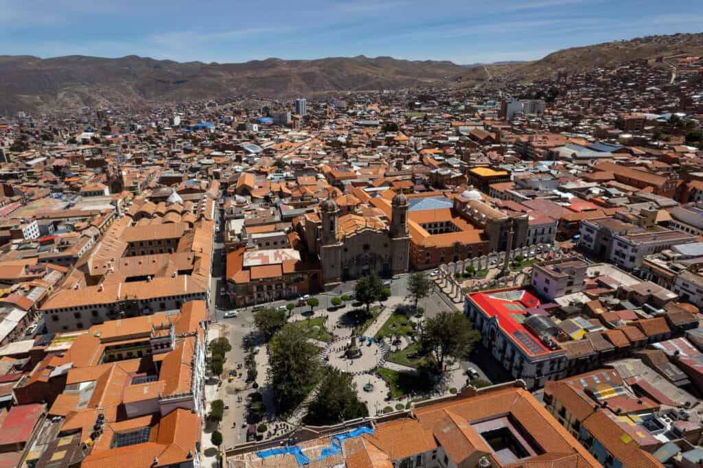 Drone view of Potosi in Bolivia. There is the main place and the main church in the center, and the mountains in the abckground.