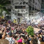 Pedra do sal on a monday night in the center of Rio de Janeiro, Brazil. there is a huge crowded listening to a samba group in the middle.