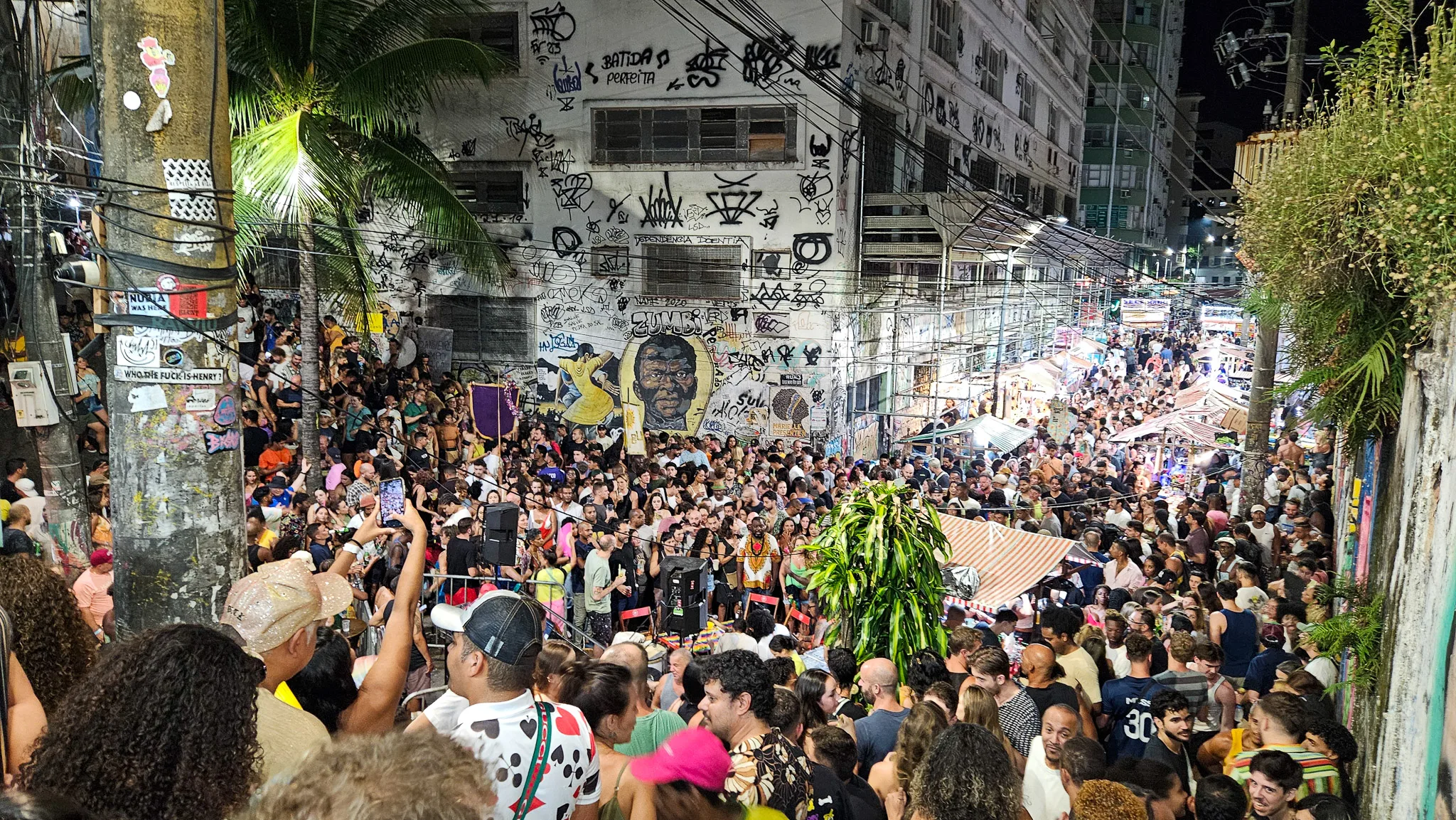 Pedra do sal on a monday night in the center of Rio de Janeiro, Brazil. there is a huge crowded listening to a samba group in the middle.