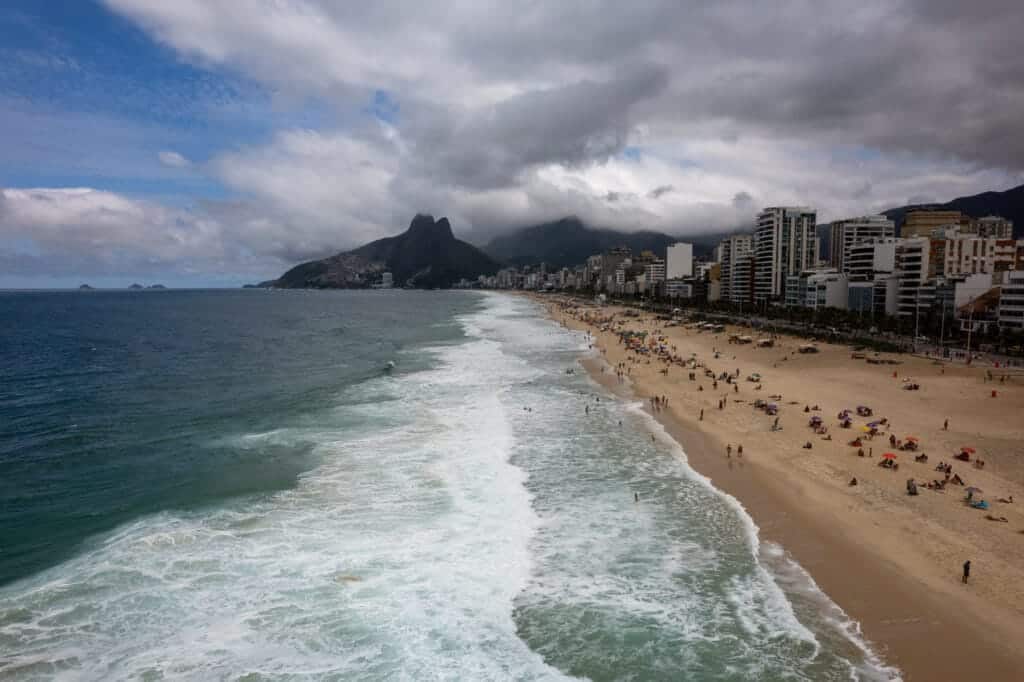 Aerial view of Ipanema beach during a cloudy day. there is the dois irmaos mountainin the background.