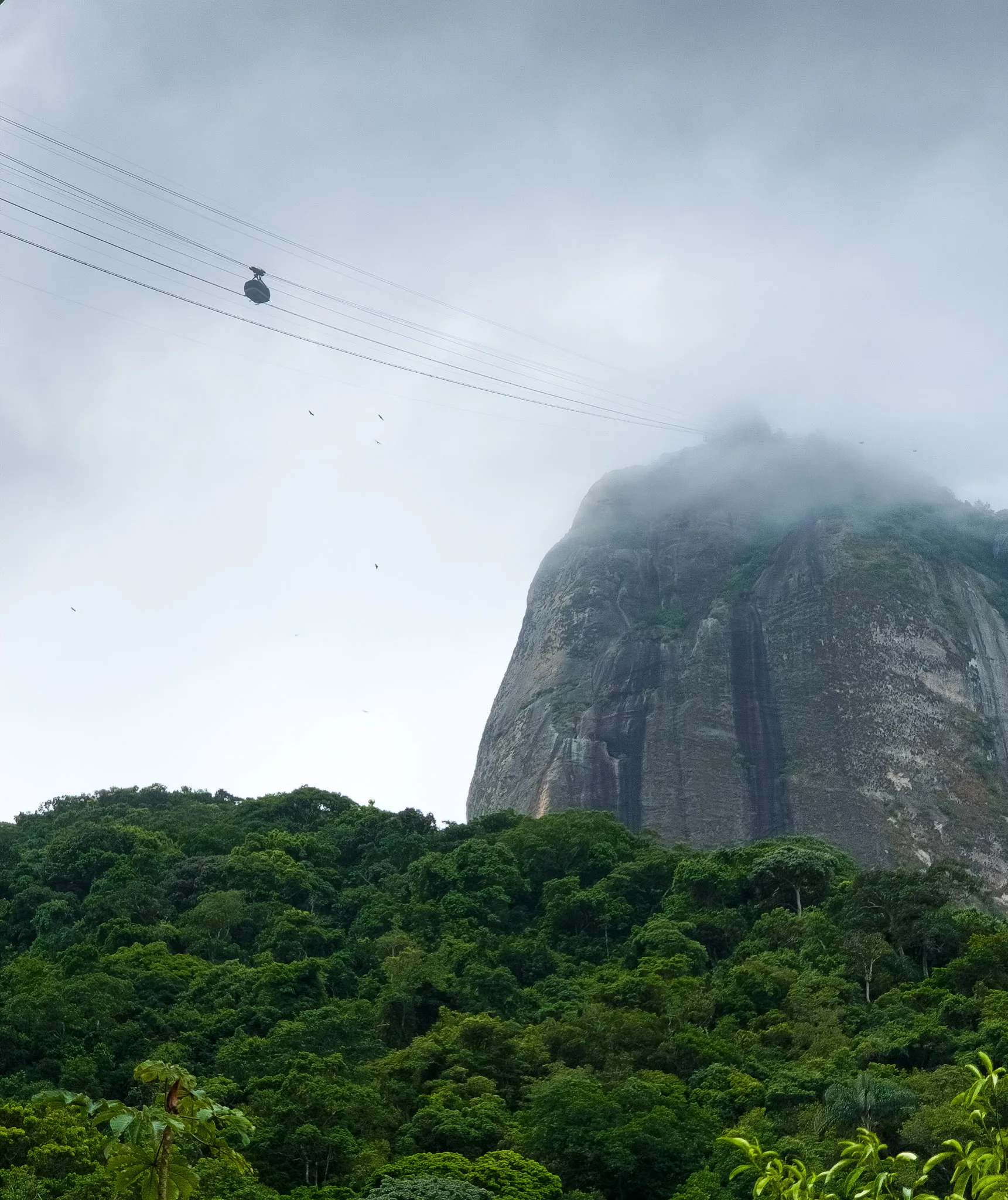Sugarloaf in the fog. we still see the cable car and the cabin going down. Rio de janeiro, Brazil.