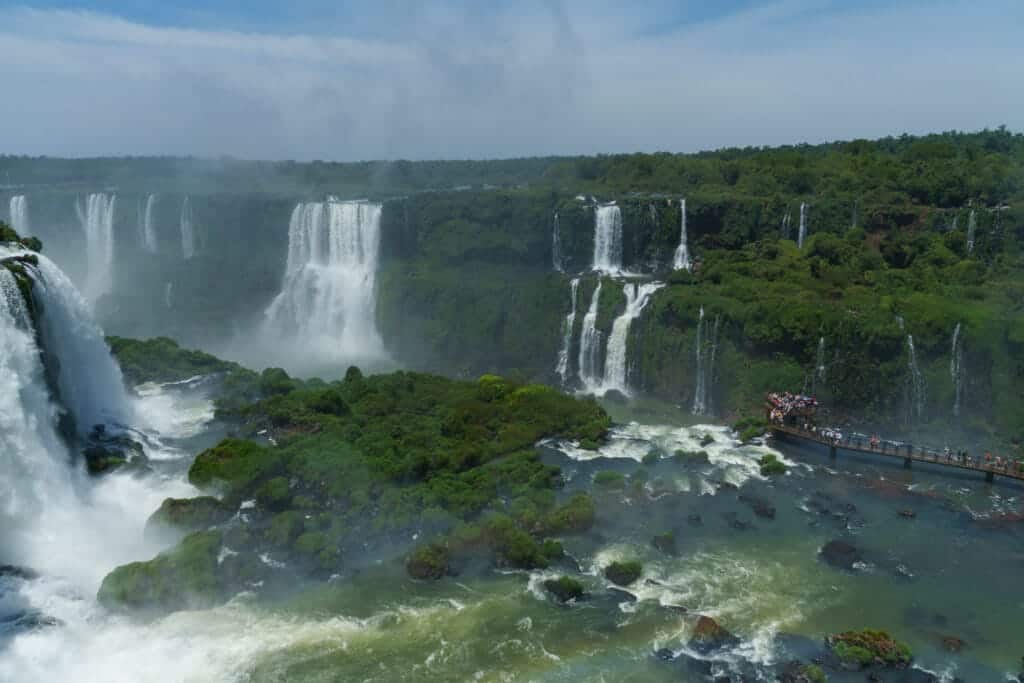 Falls of Iguazu on brazil side with the viewpoint where tourists take photos.