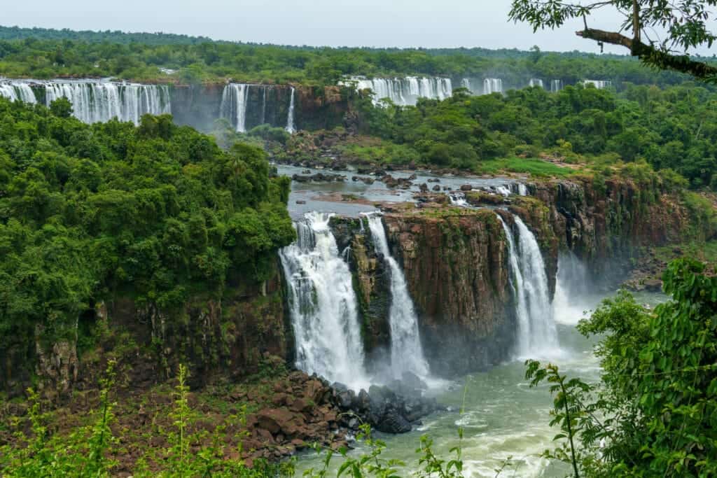 Iguazu waterfalls with cliffs and jungle nature around. Brazil.