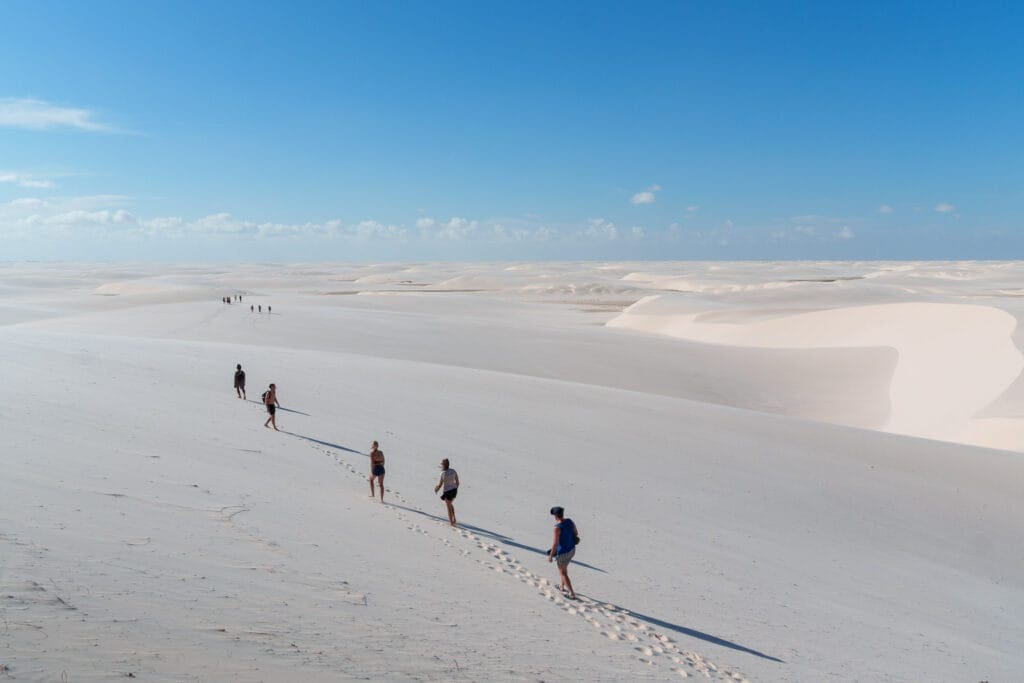 tourist walking in Lencois Maranhenses National Park, Maranhao, Brazil. it's january so the park is dry and there's no lagoons.