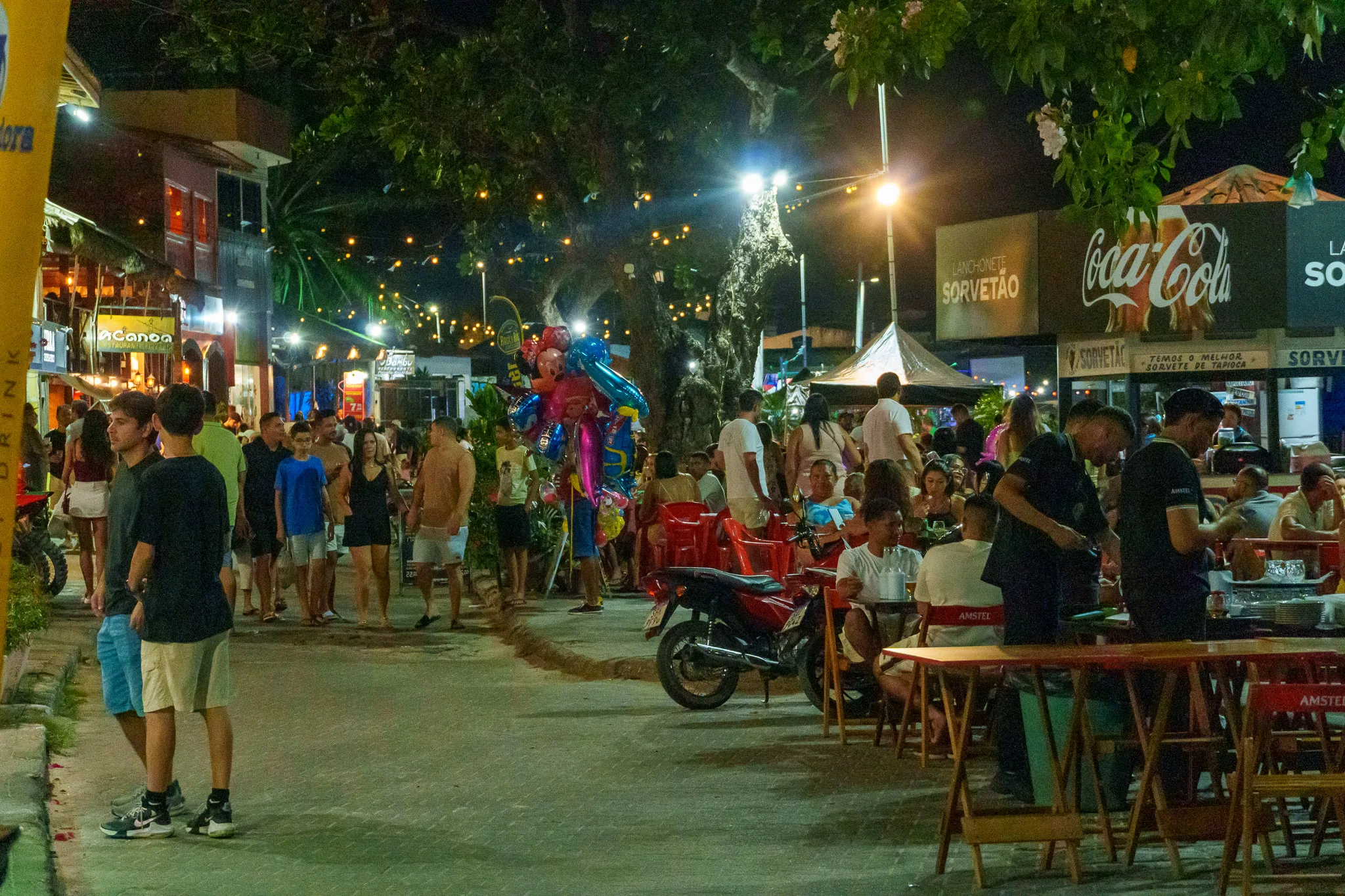 Riverfront street at Barreirinhas at night. restaurants are putting tables on the streets and meny people comes here. the ambient is very nice.