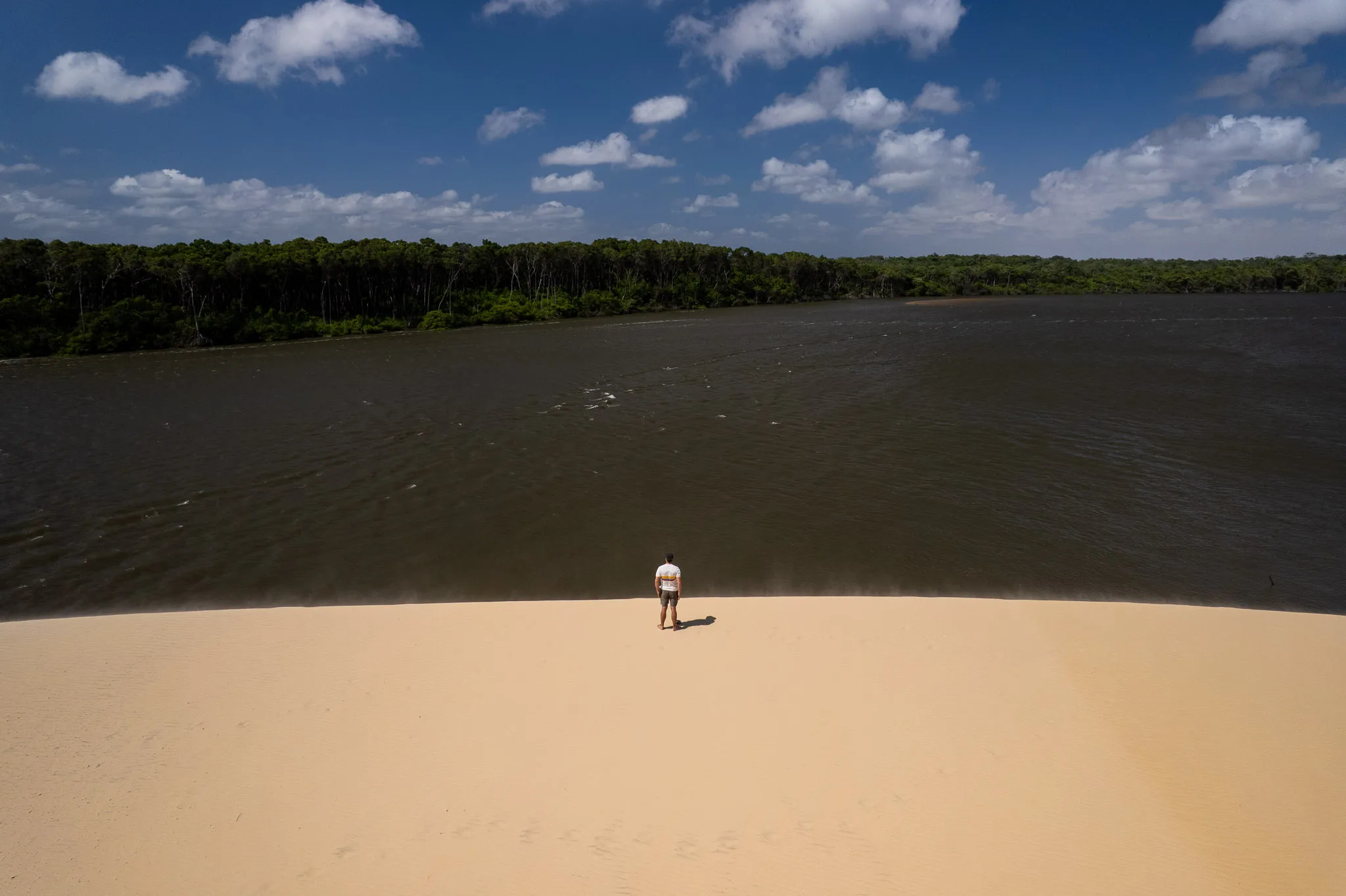 Me (Horizon Hugo) on the top a dune at the Vassouras village during the boat tour on the Preguiças river. We see the river and the jungle in the background