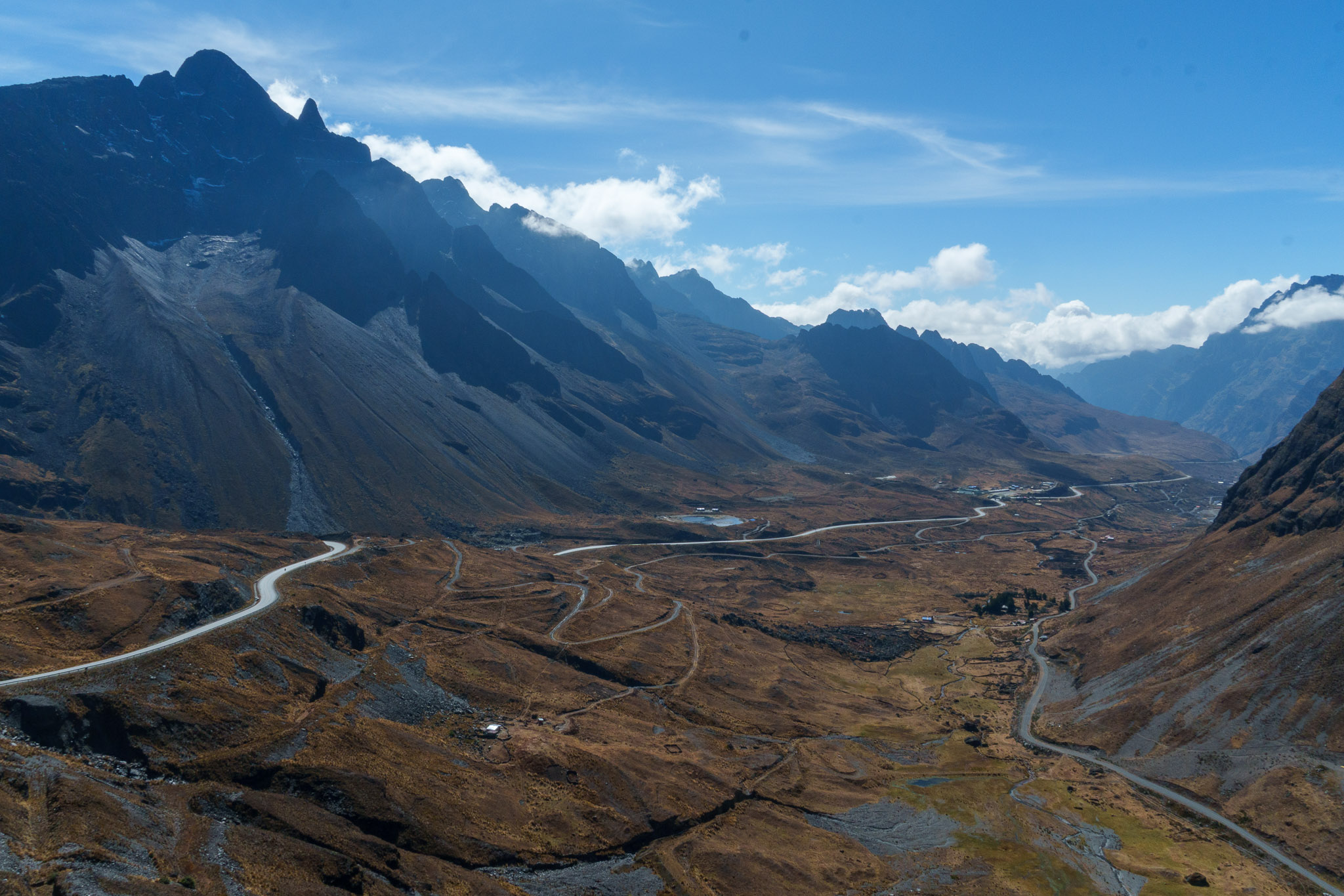 Wide view of the begining of the Death Road. the climate is cold, with rocky mountains. this part of the death road is safe with a new and larger highway.
