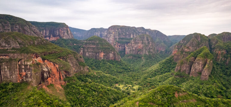 Drone view of the Huge red rocks with forest on top in the Amboro National Park, Bolivia.