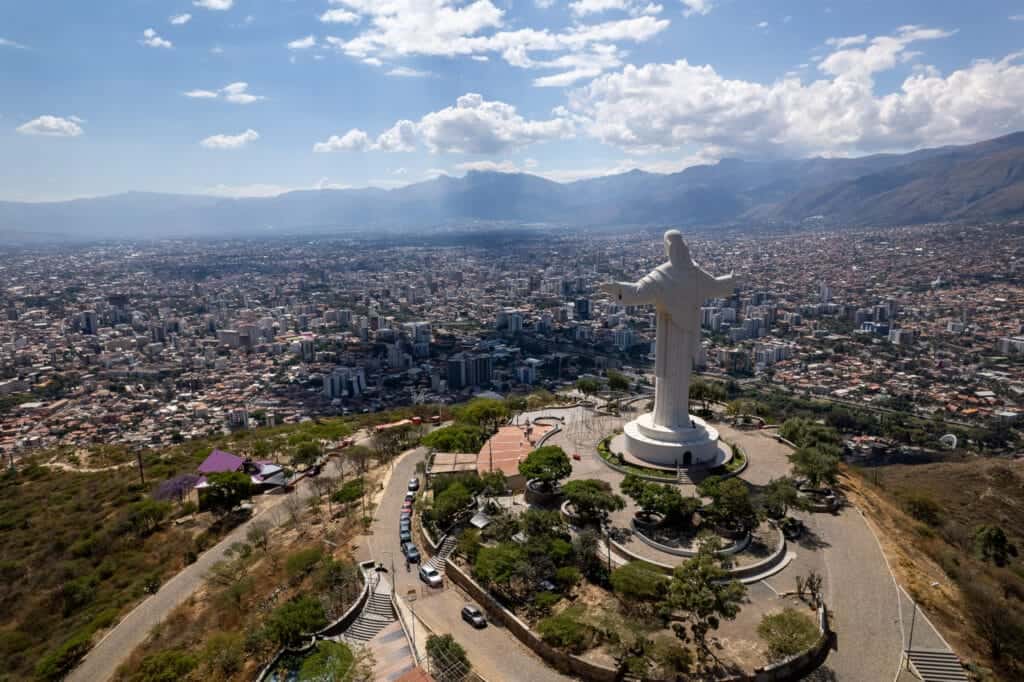 Aerial view of Cochabamaba city with the Cristo Rey in front of the city.