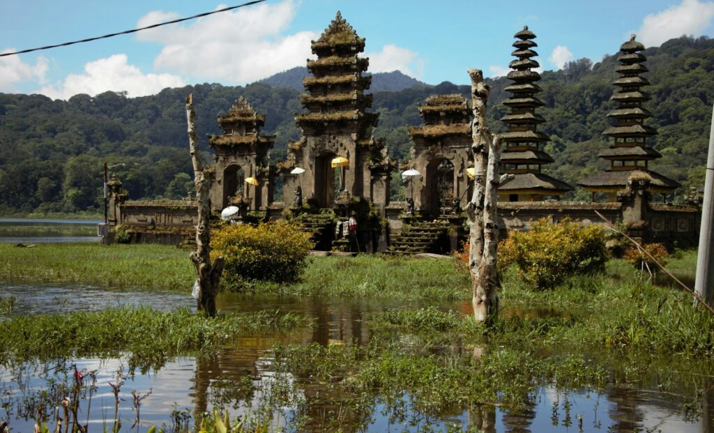 temple surrounded by water and vegetation in Munduk, Bali