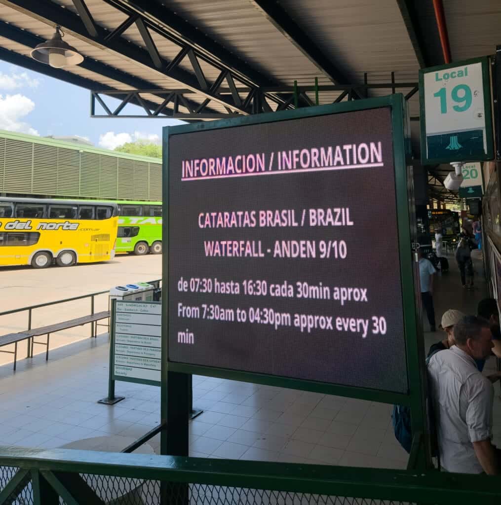 panel information at the bus terminal about the bus schedule to go to Iguazu falls.
