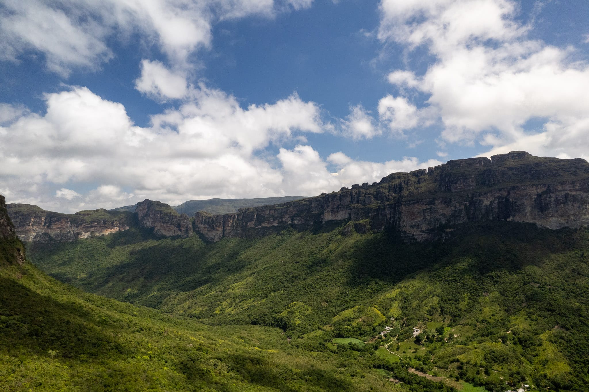 Aerial view of Vale do Pati with blue sky and green canyon, Chapada Diamantina, Brazil.