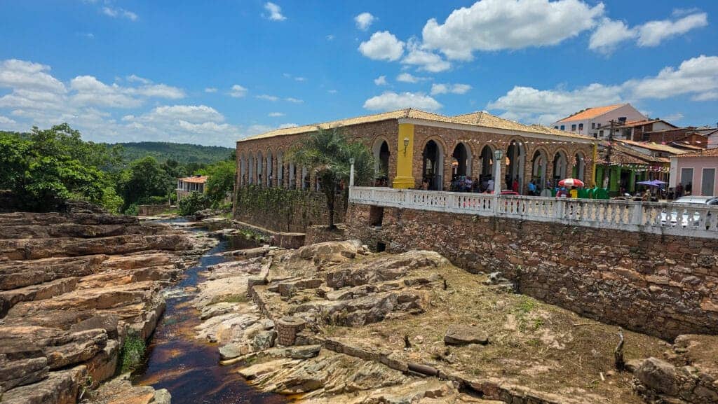 river passing trhough the middle of lencois and the main place with marketplace. Bahia, Brazil.