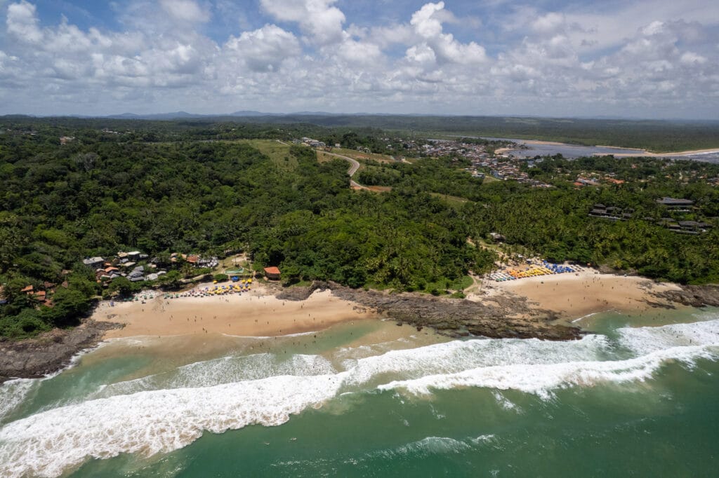 Aerial view of the praia resende and tiririca in Itacare. there is the beach, the jungle and itacare in the background.
