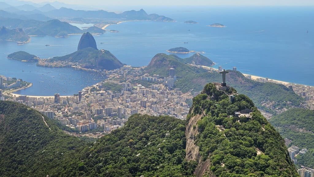Aerial view of rio. there is the christ redeemer and the bay of botafogo, with the sugarloaf and niteroi.