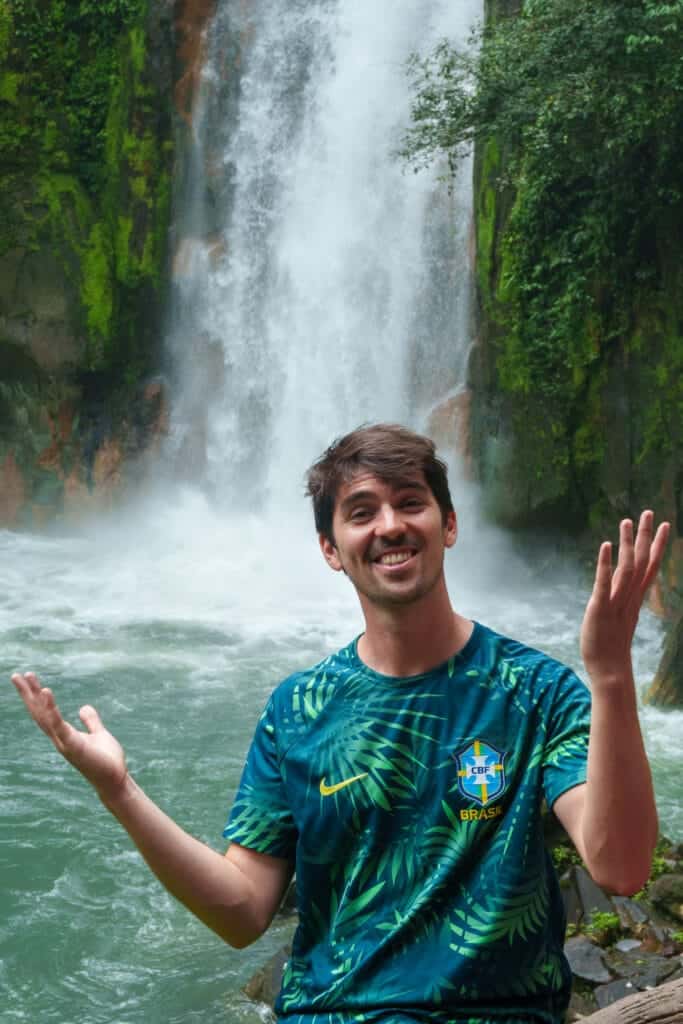 me ( horizon hugo) in front of the waterfall at rio celeste inside the volcan tneorio national park, costa rica.